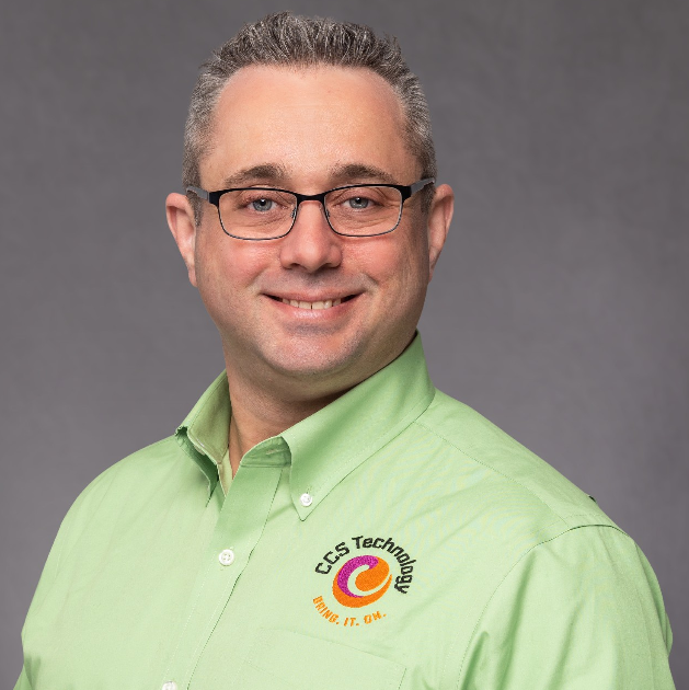 White male in pale green button down with CCS logo